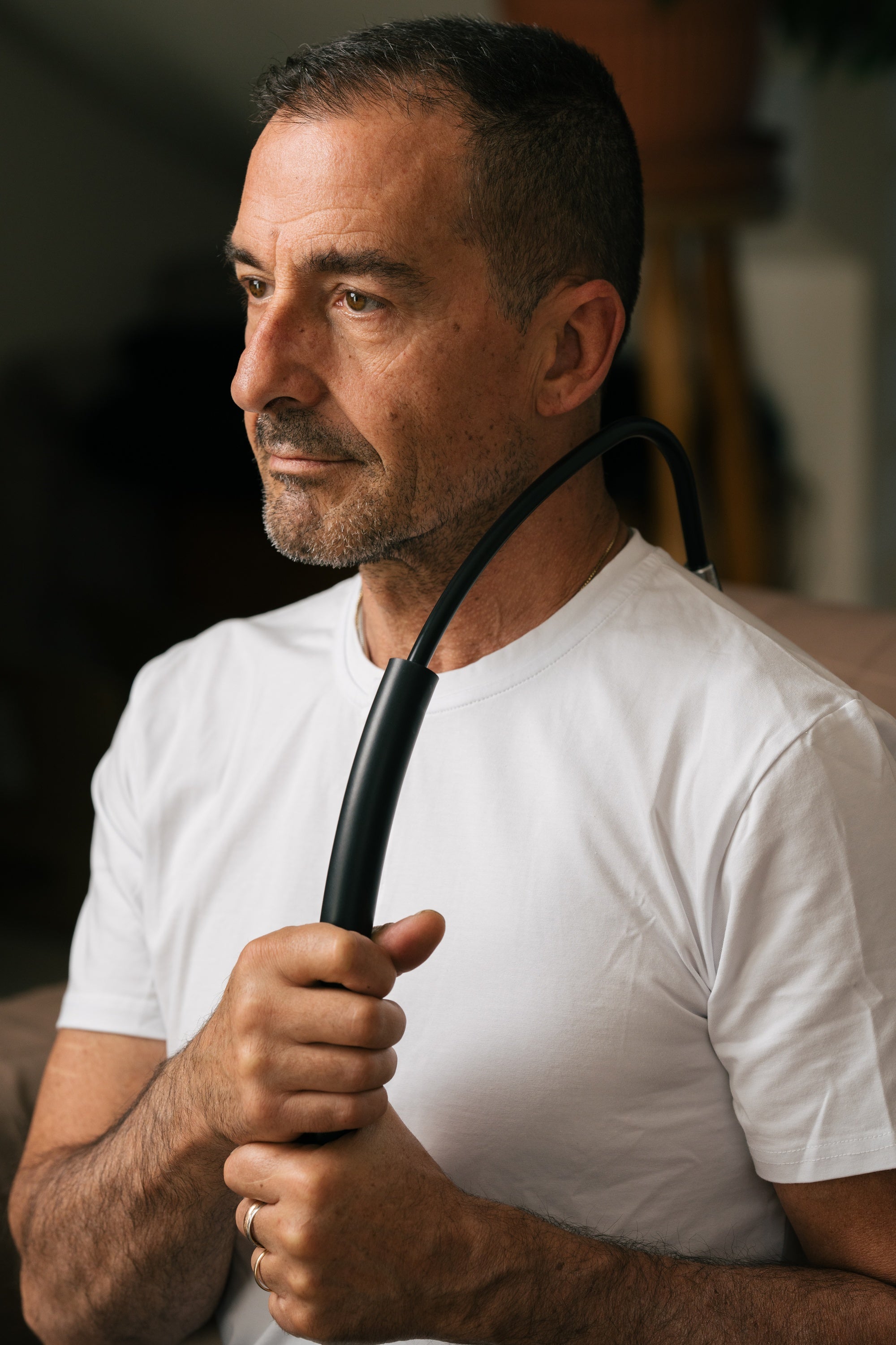 A person self massaging with Theratsu's trigger point massager.